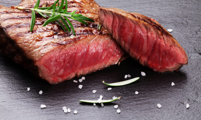 Grilled beef steak with rosemary, salt and pepper